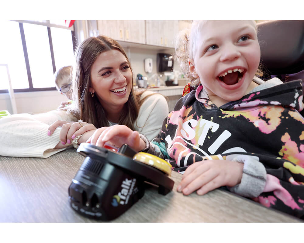 Woman and child interacting with a iTalk2 with Levels